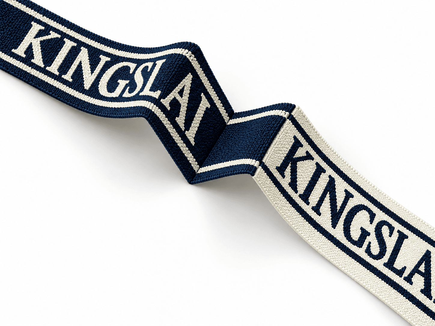 Hard finish rigid jacquard tape in a flat folded pose showing its patterned front and reverse