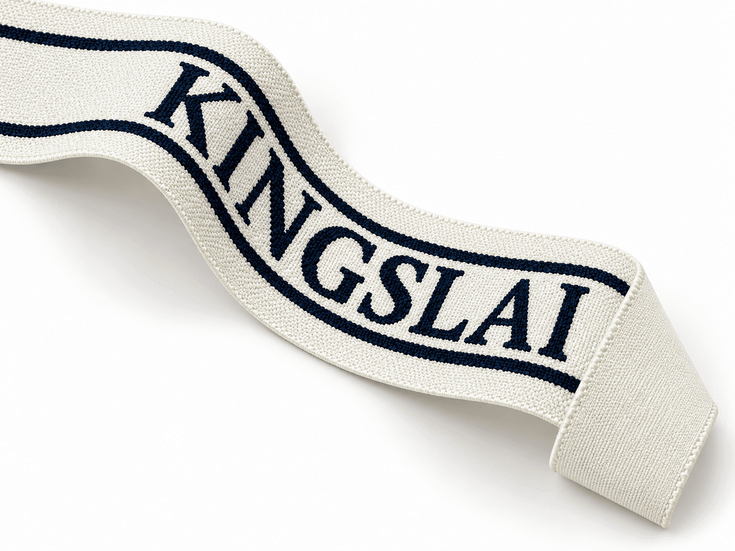 75 mm ultra soft jacquard elastic in a flat ribbon sweep with its plain reverse visible at the turned end
