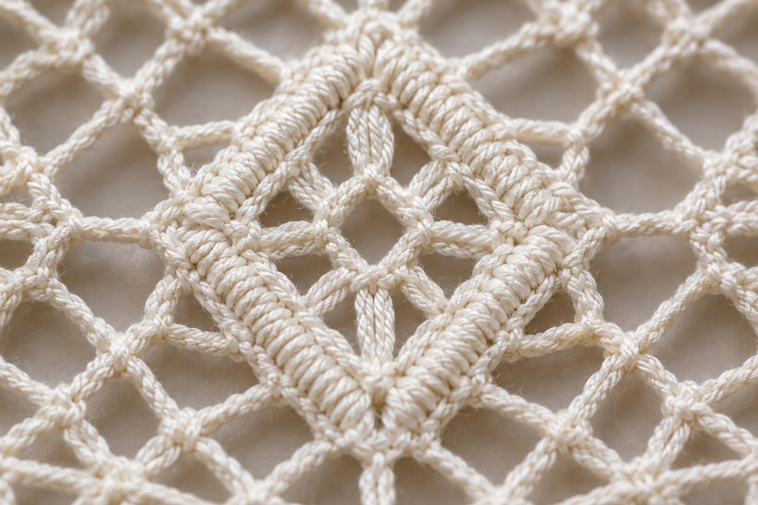 Illustrative macro of open ground and denser Torchon lace motifs