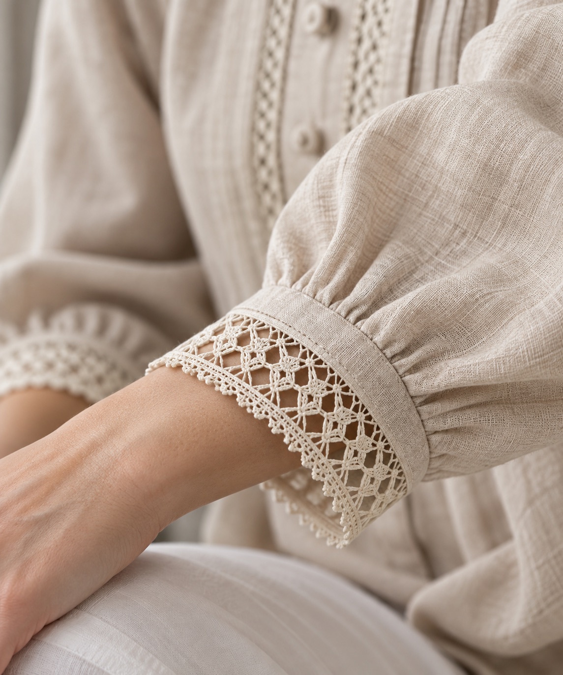 Illustrative garment cuff finished with geometric lace trim