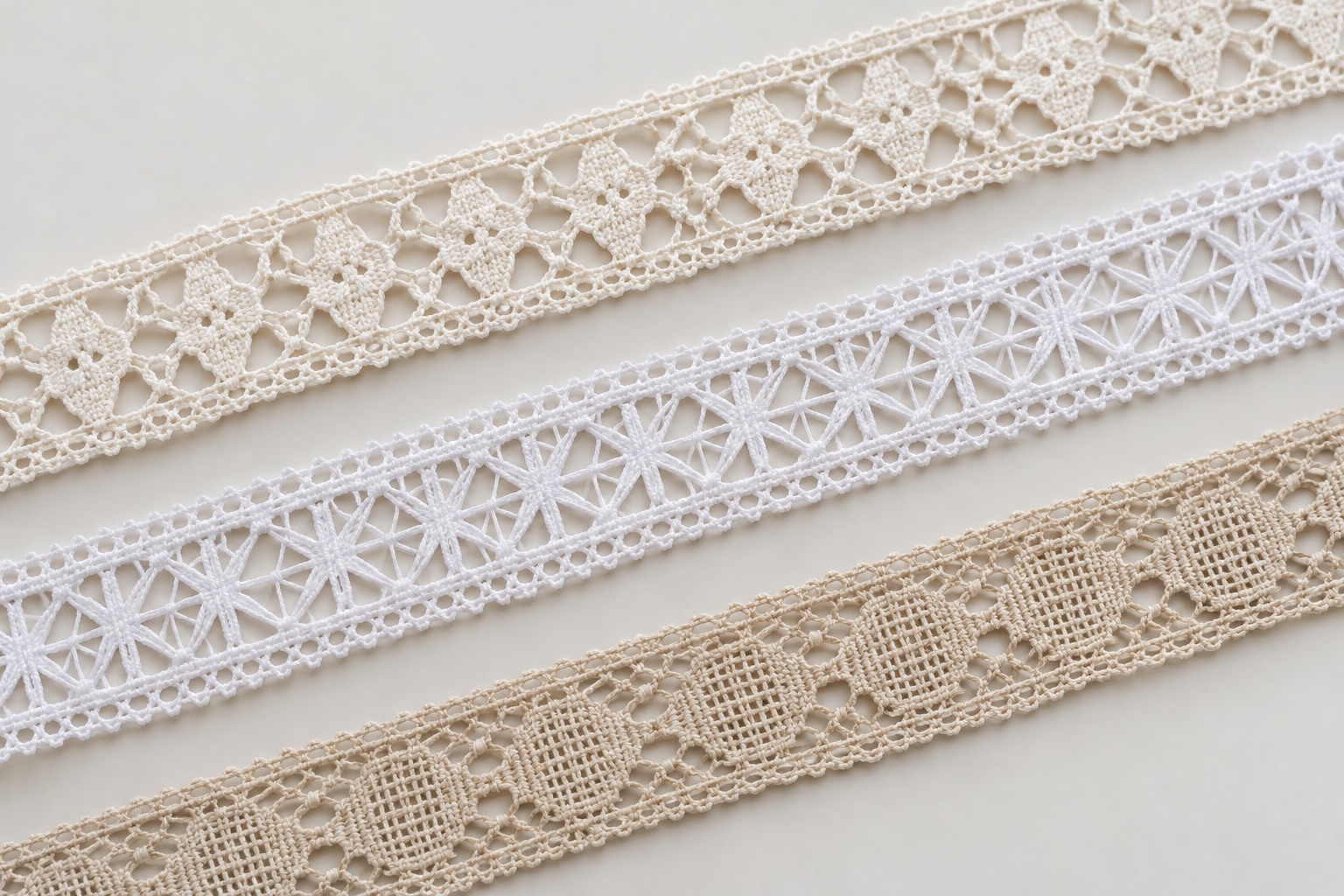 Illustrative assortment of geometric lace trims in light neutral shades